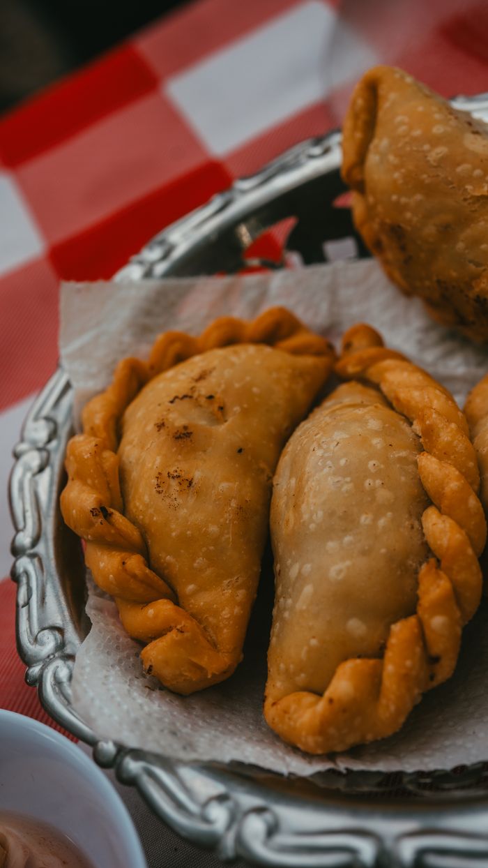about-us Close-up of delicious homemade empanadas in Uribelarrea, Argentina, offering a taste of local cuisine.